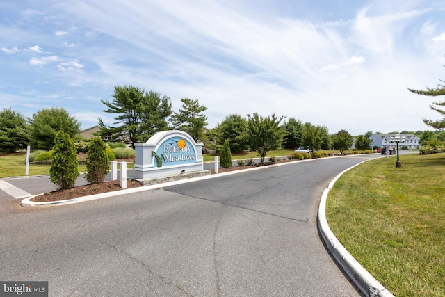 view of road featuring curbs
