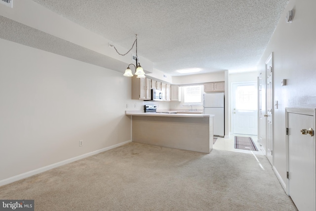 kitchen with light colored carpet, a textured ceiling, a peninsula, and white appliances
