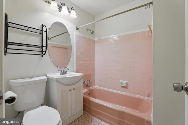 bathroom featuring toilet, bathing tub / shower combination, vanity, and tile patterned flooring