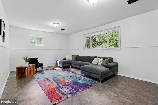 living room with wainscoting and baseboards