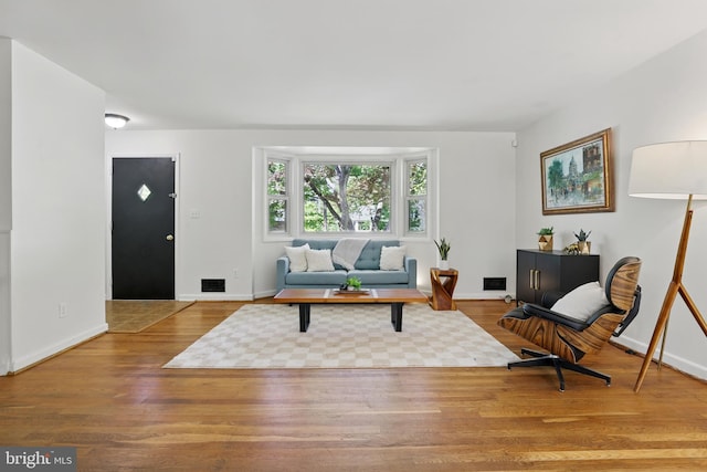 living room with wood finished floors and baseboards