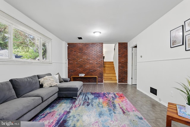 living room featuring stairway and baseboards