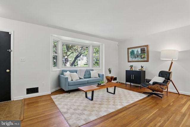 living room with wood finished floors and baseboards