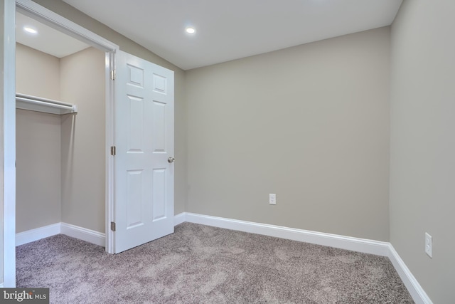 unfurnished bedroom featuring carpet floors, recessed lighting, and baseboards