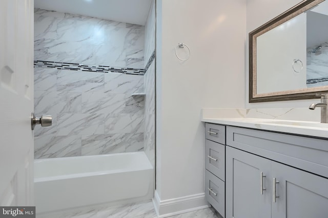 full bath featuring vanity, baseboards, bathing tub / shower combination, and marble finish floor