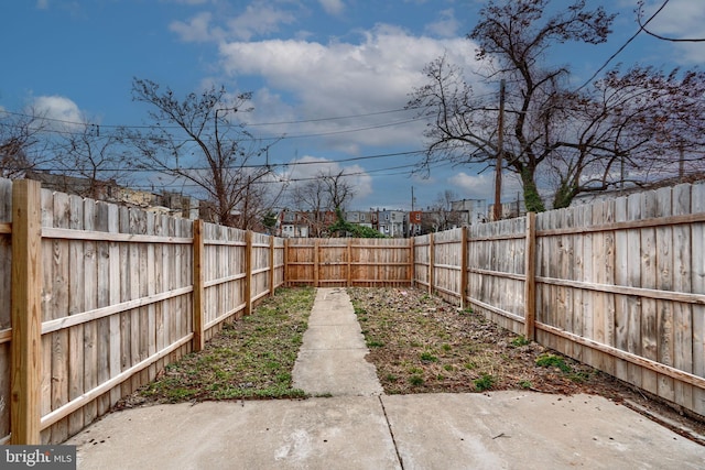 view of yard featuring a fenced backyard and a patio area