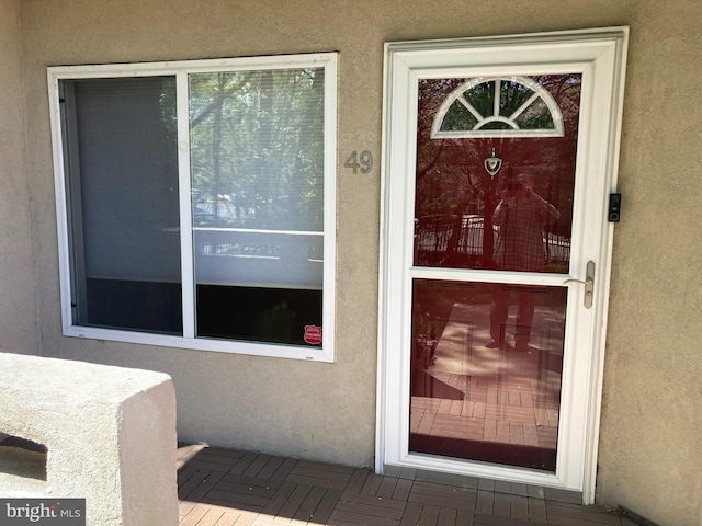 1630 Welsh Rd Unit 49G, Philadelphia, PA 19115 - doorway to property with stucco siding