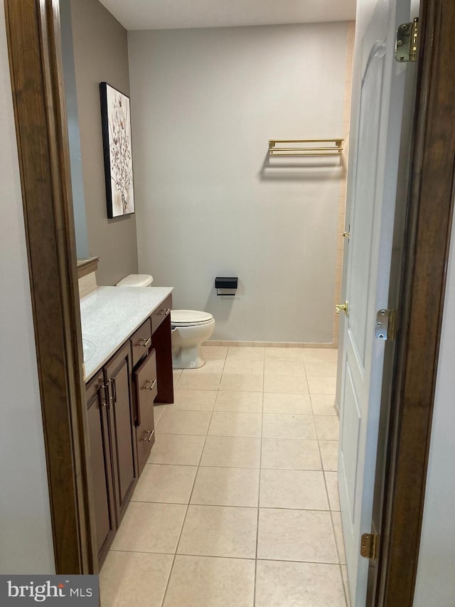 1630 Welsh Rd Unit 49G, Philadelphia, PA 19115 - bathroom with toilet, baseboards, tile patterned flooring, and vanity