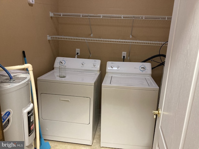 1630 Welsh Rd Unit 49G, Philadelphia, PA 19115 - laundry room featuring laundry area, washing machine and dryer, and electric water heater