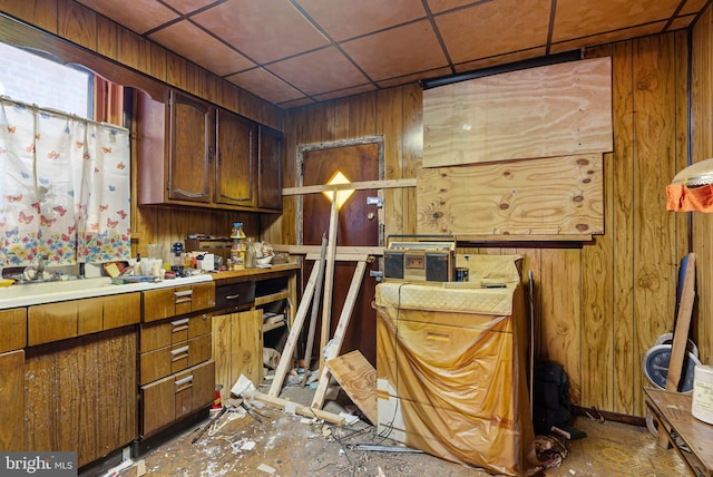 interior space featuring wood walls and a sink