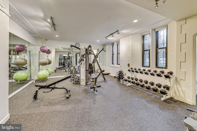 workout area featuring recessed lighting and rail lighting