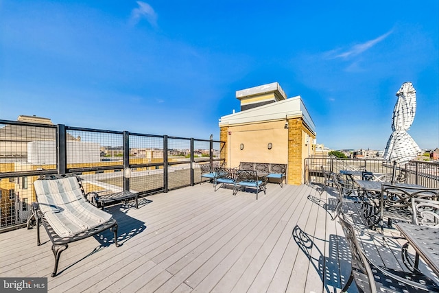 wooden terrace featuring an outdoor hangout area