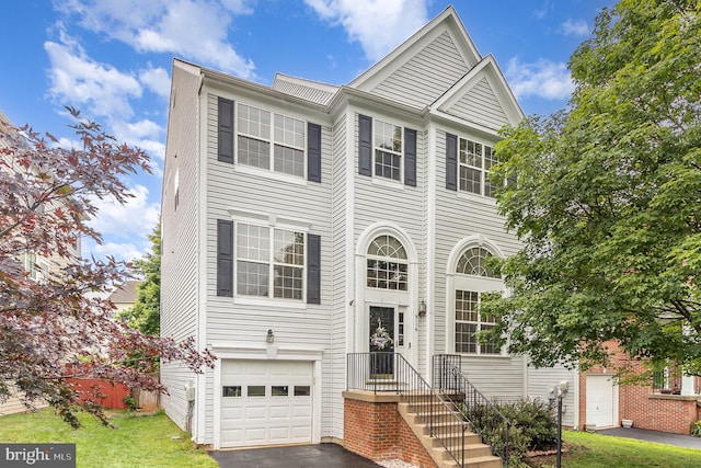 9116 Mineola Ct, Manassas, VA 20111 - multi unit property with a garage, driveway, and a front yard