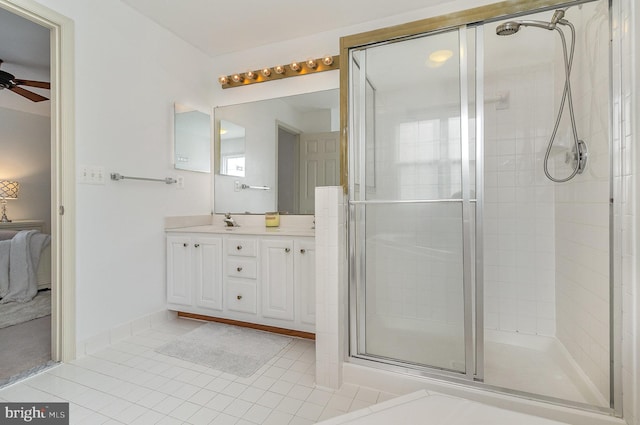 9116 Mineola Ct, Manassas, VA 20111 - ensuite bathroom featuring ceiling fan, tile patterned floors, double vanity, and a shower stall