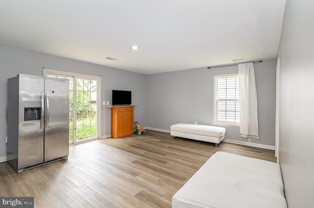 9116 Mineola Ct, Manassas, VA 20111 - unfurnished living room with light wood-style floors, baseboards, and recessed lighting