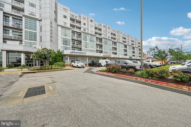 2772 Lighthouse Pt E Unit 410, Baltimore, MD 21224 - view of apartment building / complex featuring uncovered parking