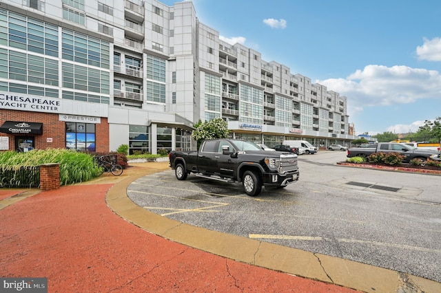 2772 Lighthouse Pt E Unit 410, Baltimore, MD 21224 - view of apartment building / complex with uncovered parking