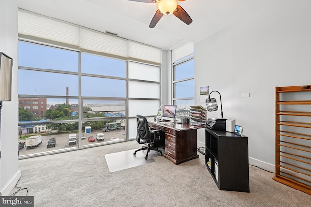 2772 Lighthouse Pt E Unit 410, Baltimore, MD 21224 - home office featuring carpet floors, ceiling fan, plenty of natural light, and floor to ceiling windows