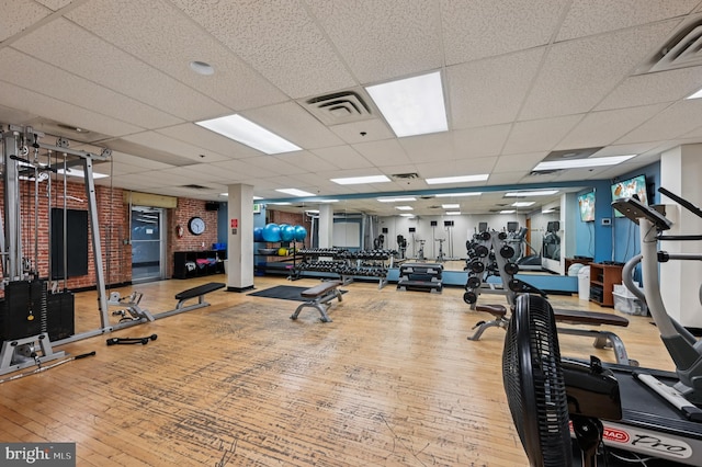 2772 Lighthouse Pt E Unit 410, Baltimore, MD 21224 - workout area featuring hardwood / wood-style flooring and a drop ceiling