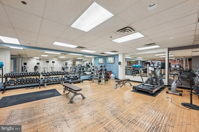 2772 Lighthouse Pt E Unit 410, Baltimore, MD 21224 - workout area featuring wood-type flooring and a paneled ceiling