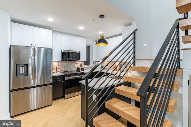 609 S Orianna St Unit 1, Philadelphia, PA 19147 - kitchen featuring recessed lighting, white cabinetry, tasteful backsplash, hanging light fixtures, and stainless steel appliances