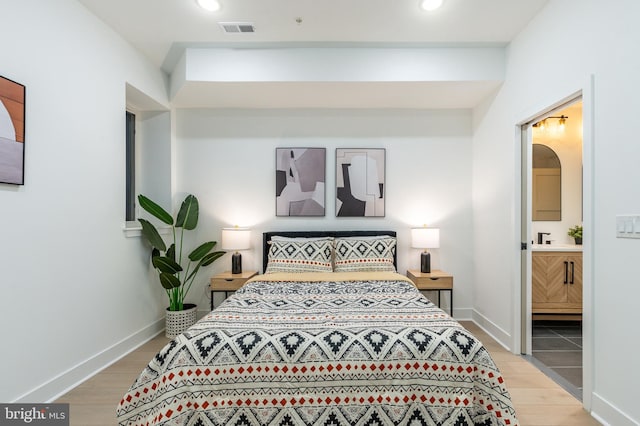 609 S Orianna St Unit 1, Philadelphia, PA 19147 - bedroom featuring ensuite bathroom, recessed lighting, light wood-style flooring, and visible vents