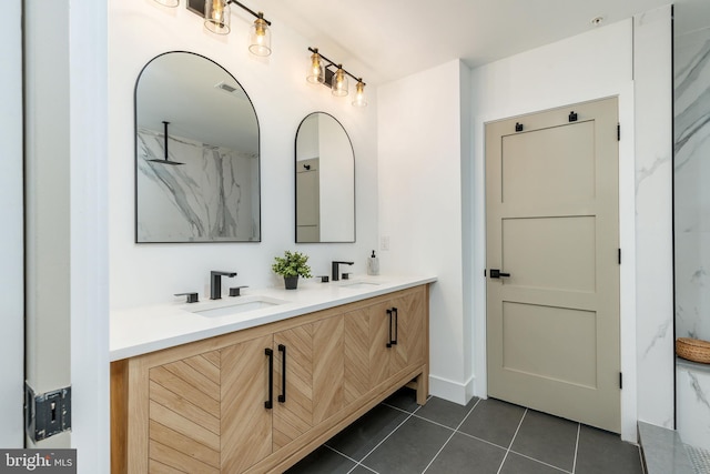 609 S Orianna St Unit 1, Philadelphia, PA 19147 - bathroom featuring double vanity, a marble finish shower, a sink, and tile patterned flooring