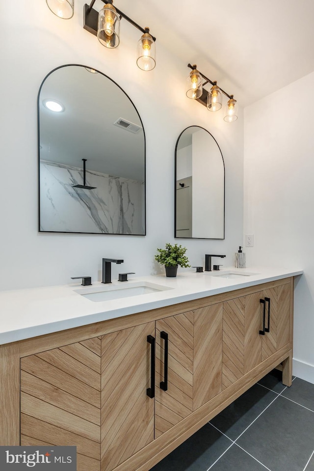 609 S Orianna St Unit 1, Philadelphia, PA 19147 - full bathroom featuring double vanity, visible vents, a sink, and tile patterned flooring