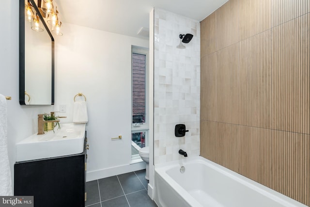 609 S Orianna St Unit 1, Philadelphia, PA 19147 - bathroom with tile patterned flooring, vanity, toilet, baseboards, and tub / shower combination