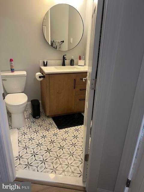 bathroom featuring toilet and vanity