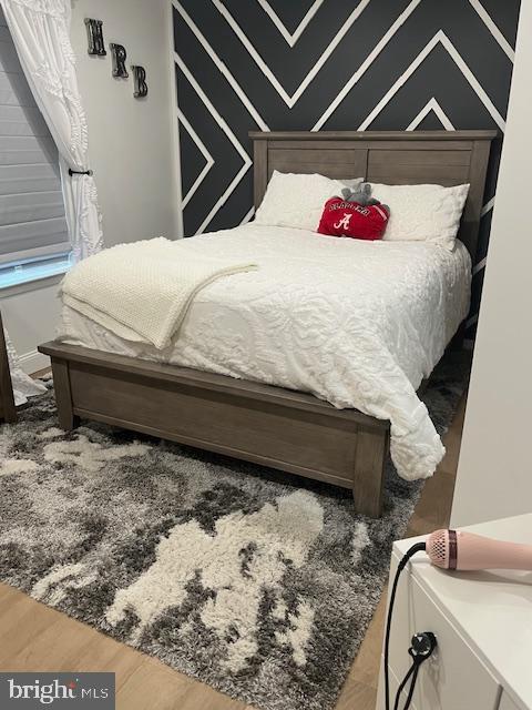 bedroom featuring wood finished floors