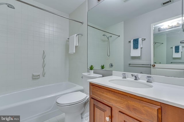 bathroom featuring toilet, vanity, tub / shower combination, and tile patterned flooring