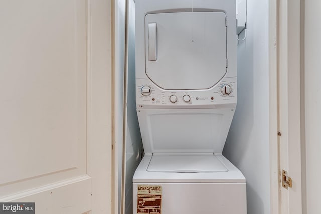 washroom with stacked washer / dryer