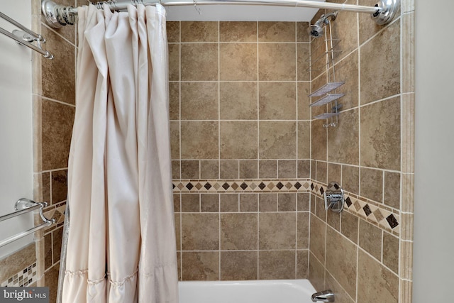 bathroom with tiled shower