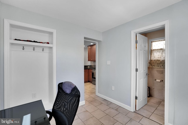 office with light tile patterned floors and baseboards