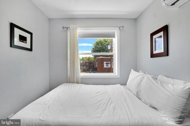 bedroom featuring a wall unit AC
