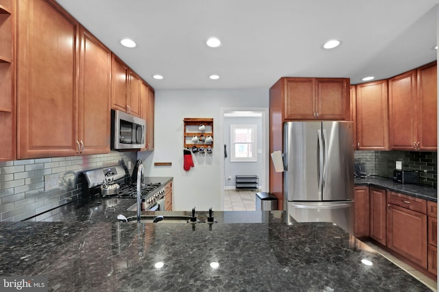 kitchen with decorative backsplash, appliances with stainless steel finishes, open shelves, dark stone counters, and recessed lighting