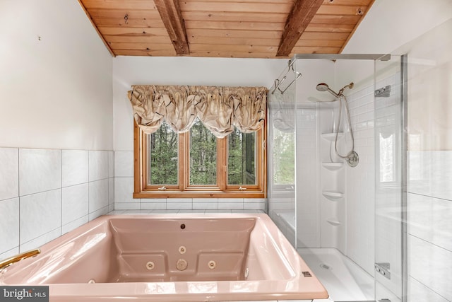 full bathroom with a tub with jets, lofted ceiling with beams, a shower stall, and wood ceiling