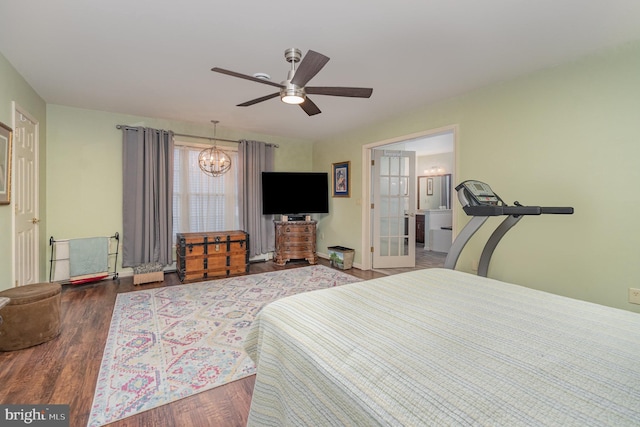 bedroom with baseboards, ceiling fan with notable chandelier, and wood finished floors