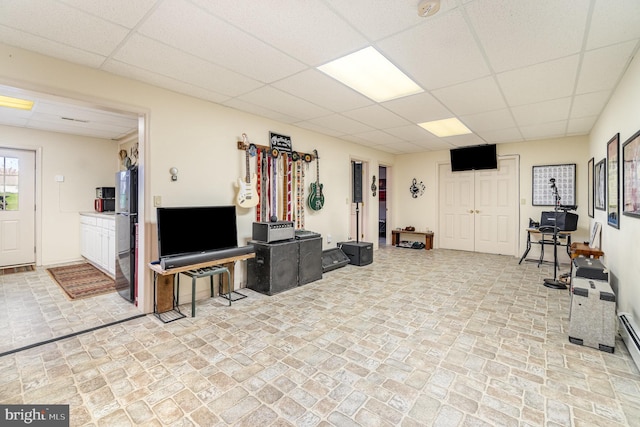 living room featuring a paneled ceiling