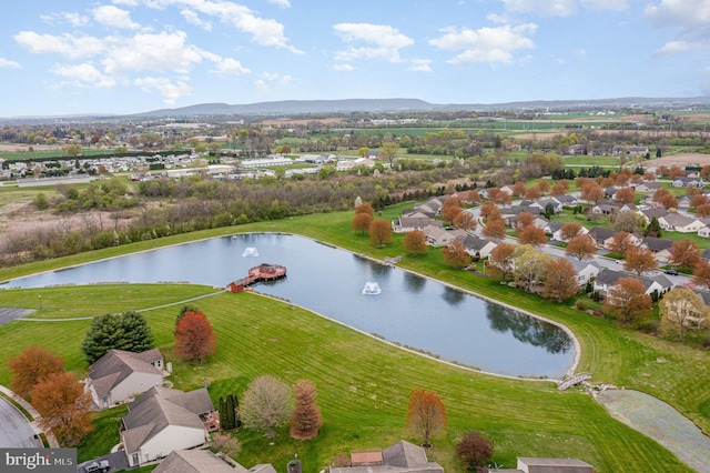 birds eye view of property featuring a water and mountain view