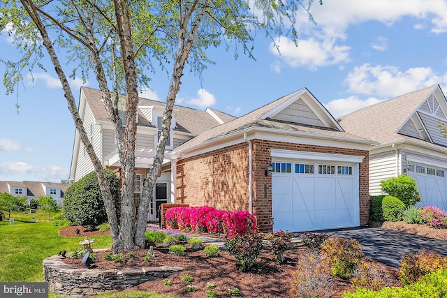 44451 Cruden Bay Dr, Ashburn, VA 20147 - view of front facade featuring a garage, a front yard, brick siding, a shingled roof, and driveway
