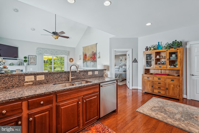 44451 Cruden Bay Dr, Ashburn, VA 20147 - kitchen with ceiling fan, a sink, wood finished floors, stainless steel dishwasher, and vaulted ceiling