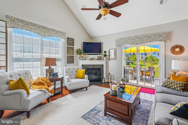 44451 Cruden Bay Dr, Ashburn, VA 20147 - living room featuring a ceiling fan, a fireplace with flush hearth, a healthy amount of sunlight, and high vaulted ceiling