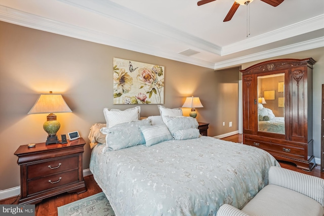 44451 Cruden Bay Dr, Ashburn, VA 20147 - bedroom with crown molding, baseboards, a raised ceiling, a ceiling fan, and dark wood finished floors