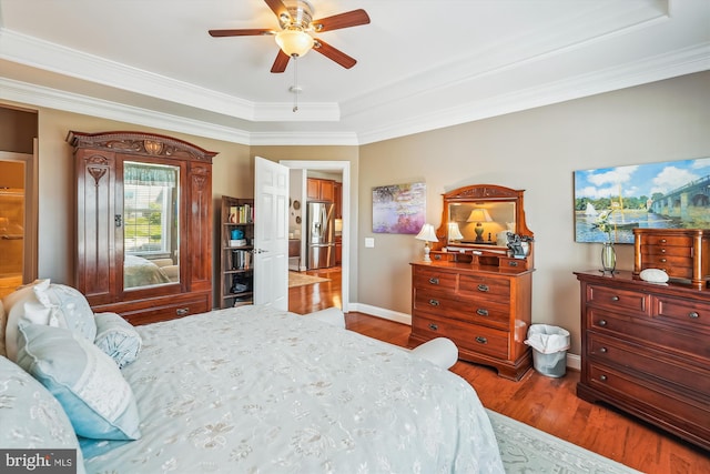 44451 Cruden Bay Dr, Ashburn, VA 20147 - bedroom with wood finished floors, stainless steel fridge with ice dispenser, baseboards, ornamental molding, and a tray ceiling
