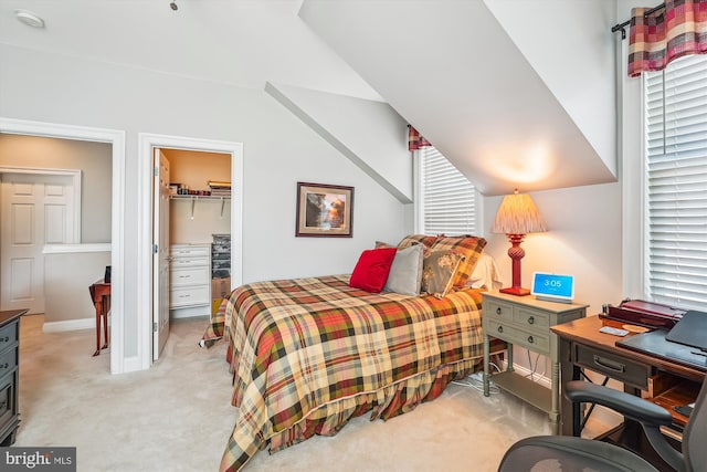 44451 Cruden Bay Dr, Ashburn, VA 20147 - bedroom featuring light colored carpet, baseboards, a walk in closet, and a closet