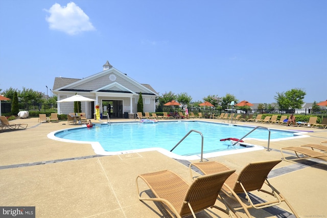 44451 Cruden Bay Dr, Ashburn, VA 20147 - community pool with a patio area and fence