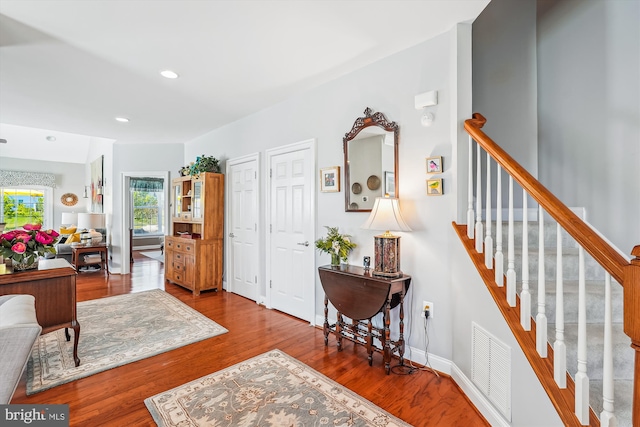 44451 Cruden Bay Dr, Ashburn, VA 20147 - entrance foyer with visible vents, wood finished floors, stairway, baseboards, and recessed lighting