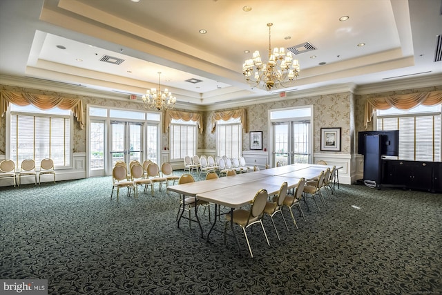 44451 Cruden Bay Dr, Ashburn, VA 20147 - dining area with french doors, a raised ceiling, and a chandelier